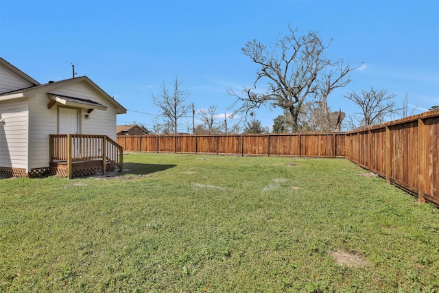 view of yard with a fenced backyard