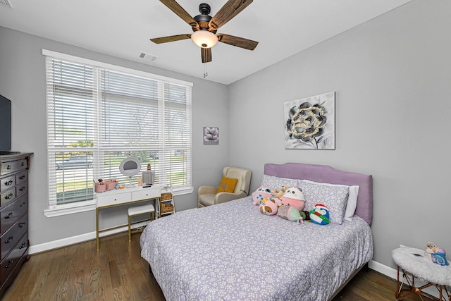 bedroom with baseboards, visible vents, and dark wood-style flooring