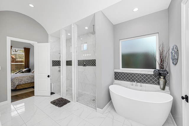 full bath featuring marble finish floor, a marble finish shower, recessed lighting, a freestanding bath, and connected bathroom