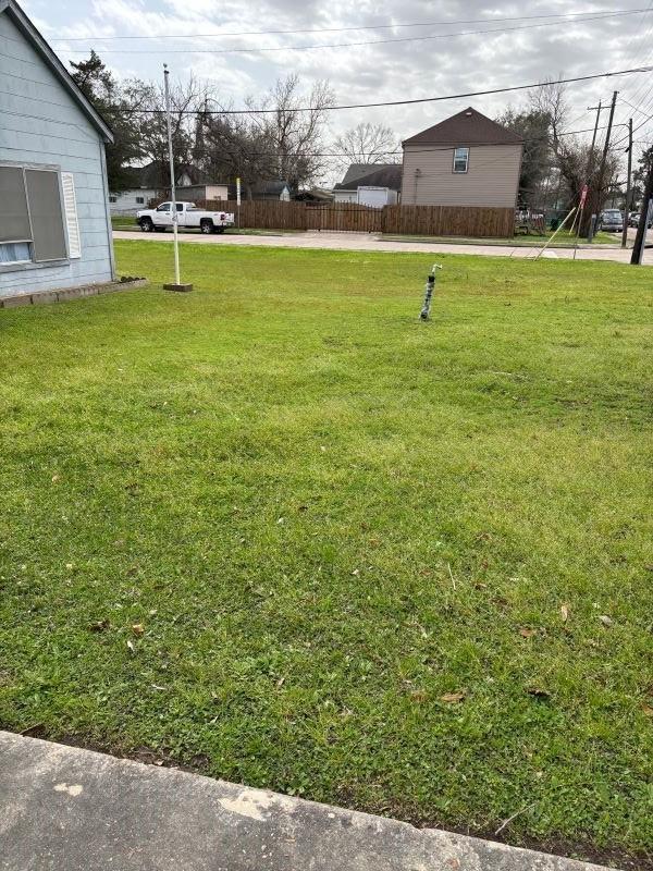 1228 Cypress St, Baytown, TX 77520 - view of yard featuring concrete driveway