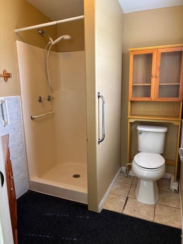 1228 Cypress St, Baytown, TX 77520 - full bath with toilet, a stall shower, and tile patterned flooring