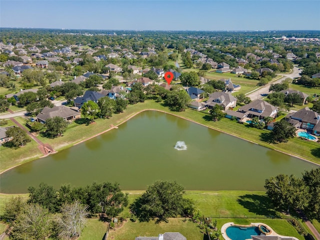 bird's eye view featuring a residential view and a water view