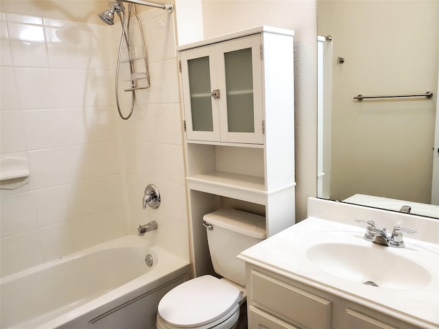 bathroom with vanity, shower / tub combination, and toilet