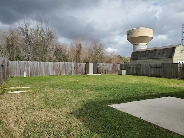 view of yard with a fenced backyard