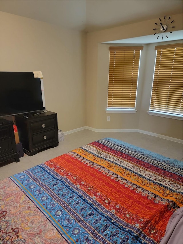 bedroom featuring baseboards