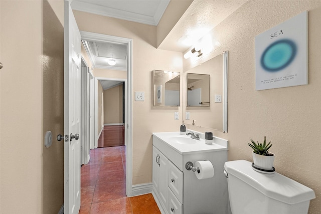 half bath with a textured wall, toilet, tile patterned flooring, crown molding, and vanity