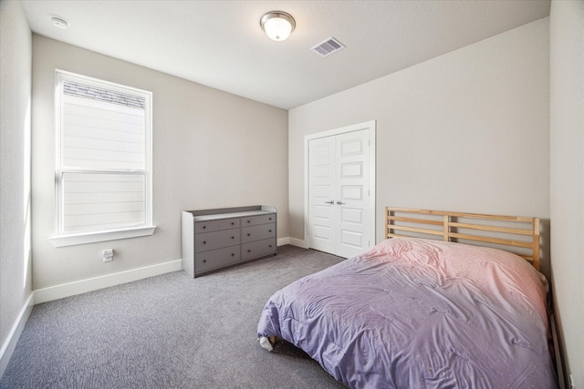 bedroom featuring carpet, visible vents, and baseboards