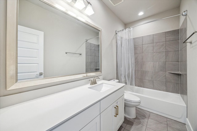 full bath with visible vents, vanity, toilet, and shower / bathtub combination with curtain