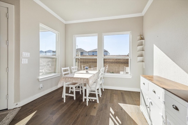 dining room featuring baseboards, dark wood finished floors, and crown molding