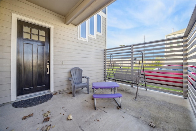 doorway to property with a balcony