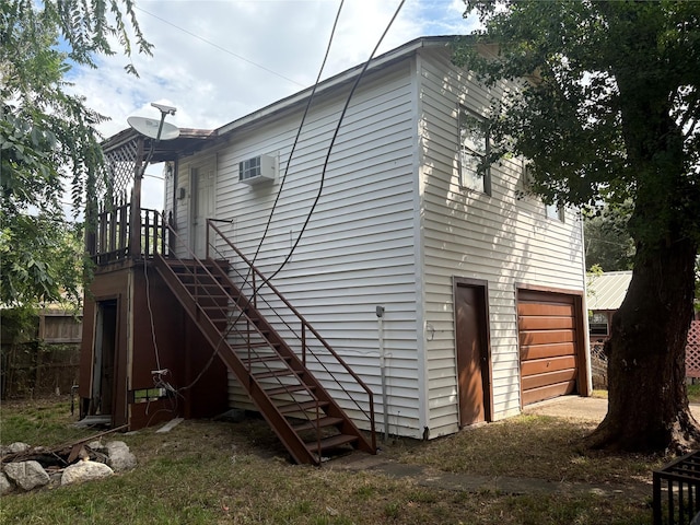 rear view of house with an attached garage