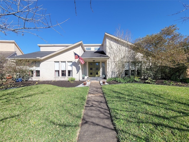 mid-century inspired home featuring a front yard