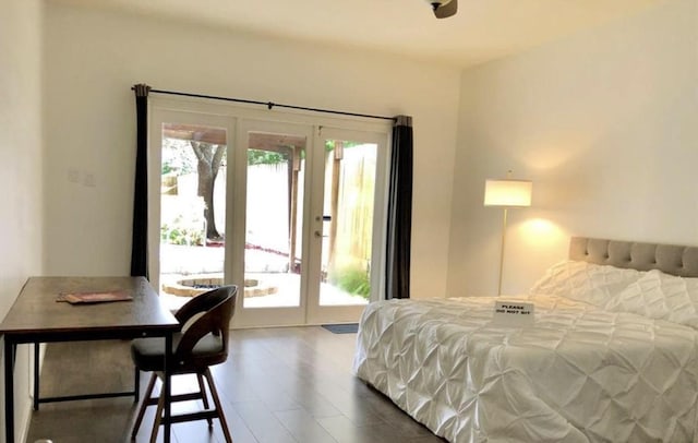 bedroom with access to exterior, french doors, and multiple windows