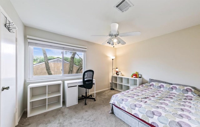 carpeted bedroom with visible vents, ceiling fan, and baseboards