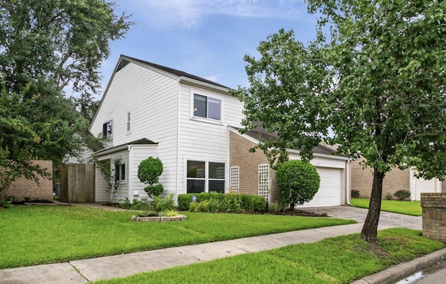 view of front of property featuring a garage, a front yard, driveway, and fence