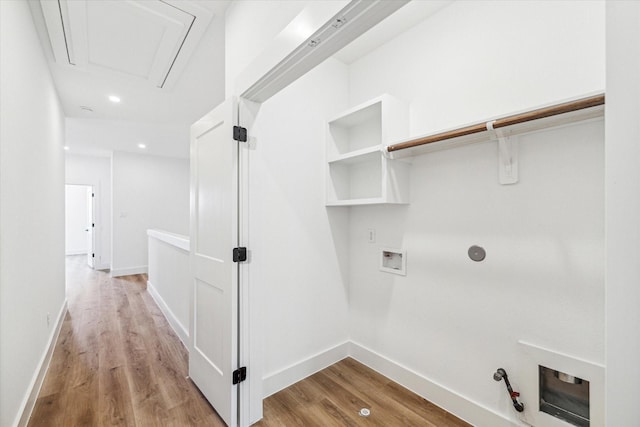 laundry area with laundry area, baseboards, hookup for a gas dryer, wood finished floors, and hookup for a washing machine