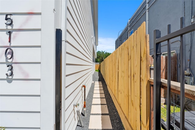 view of home's exterior with fence