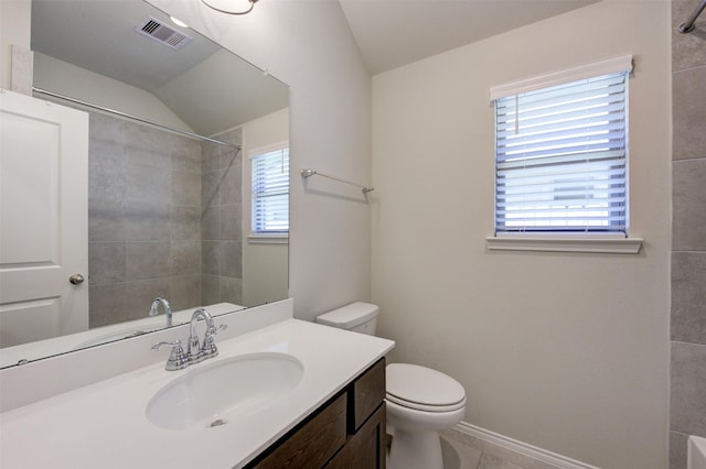 full bath with visible vents, toilet, vanity, baseboards, and walk in shower