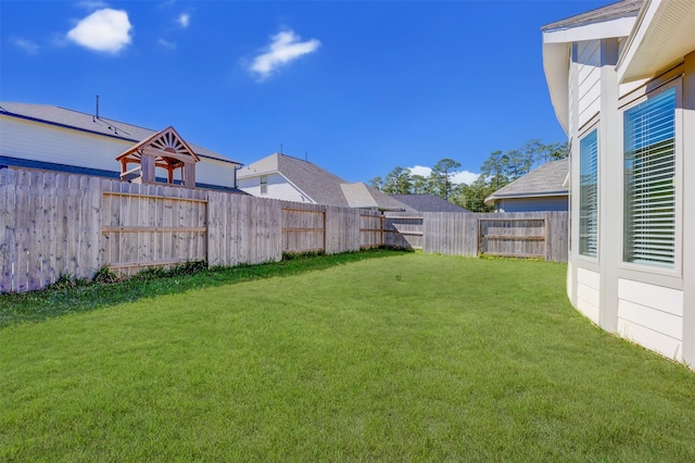 view of yard featuring a fenced backyard