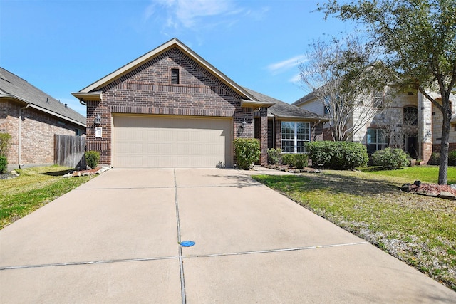 view of front of property featuring an attached garage, brick siding, fence, driveway, and a front lawn