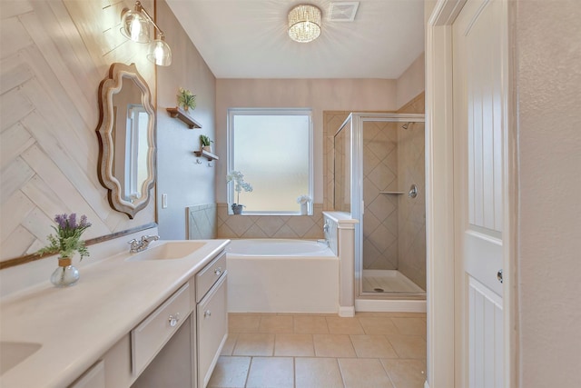 full bath featuring a garden tub, tile patterned flooring, vanity, visible vents, and a stall shower