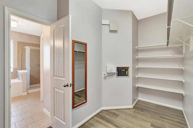 spacious closet with wood finished floors