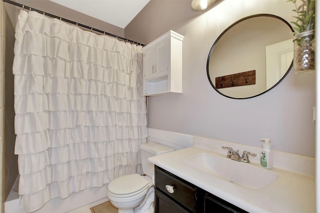 bathroom with shower / bathtub combination with curtain, vanity, and toilet