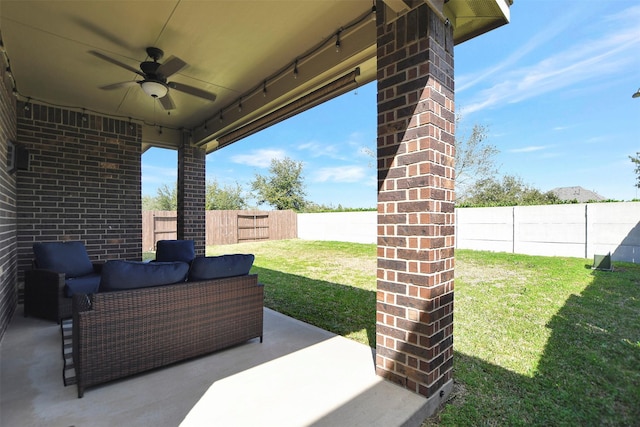 view of patio / terrace with a fenced backyard, an outdoor living space, and a ceiling fan