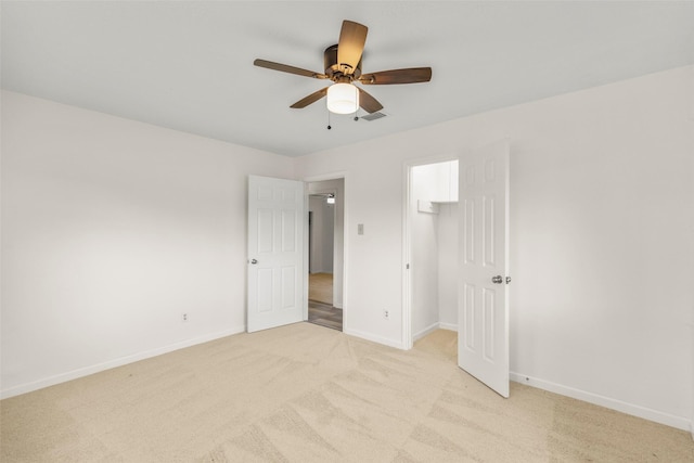 unfurnished bedroom with light carpet, baseboards, visible vents, and ceiling fan