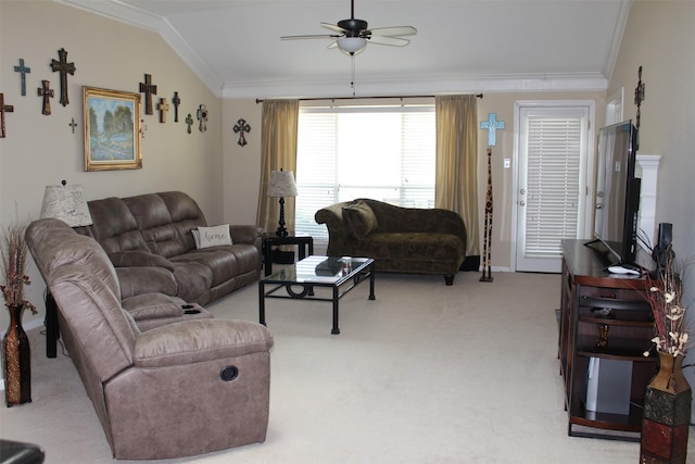 carpeted living area with crown molding, baseboards, lofted ceiling, and ceiling fan