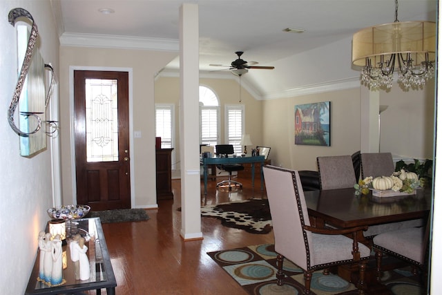 dining area with visible vents, baseboards, ornamental molding, ceiling fan with notable chandelier, and wood finished floors