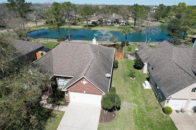 aerial view featuring a water view and a residential view