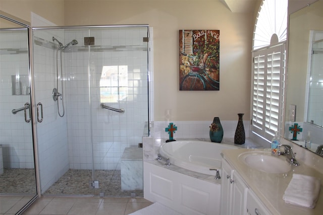 bathroom with vanity, tile patterned floors, a bath, and a shower stall