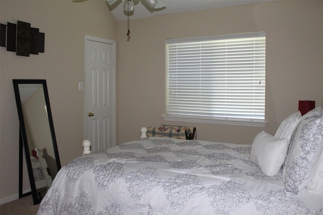 bedroom featuring vaulted ceiling and ceiling fan