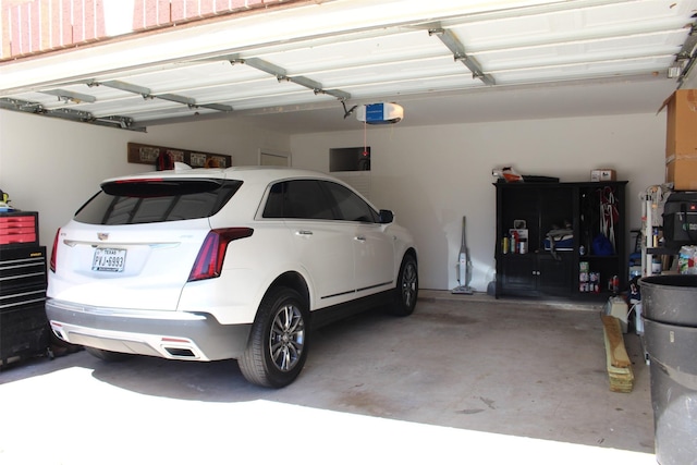 garage featuring a garage door opener