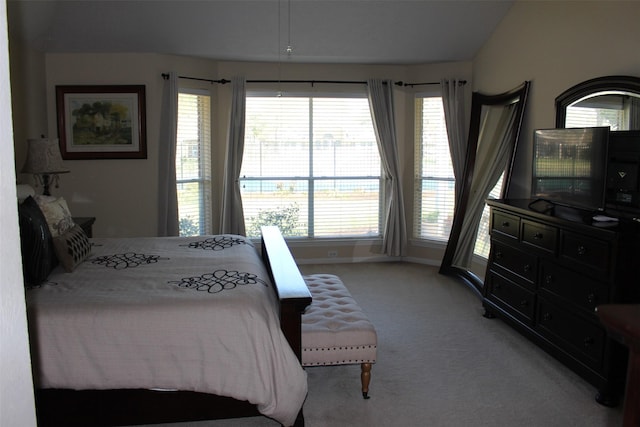 carpeted bedroom featuring baseboards