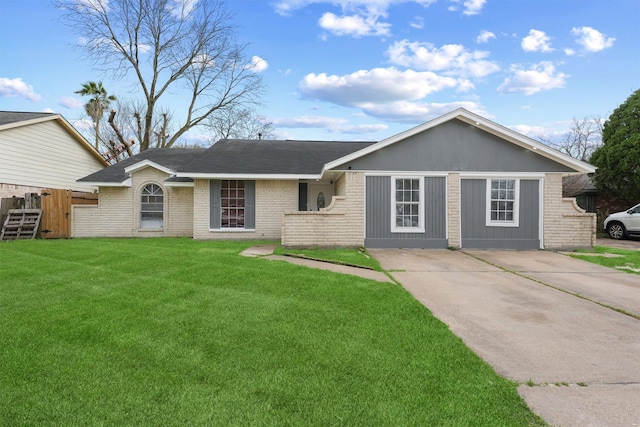 ranch-style house featuring fence, a front lawn, concrete driveway, and brick siding