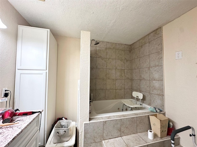 bathroom with a combined bath / shower with jetted tub, a textured ceiling, and a textured wall