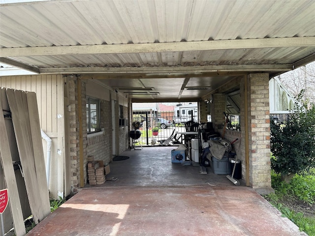 view of parking / parking lot with fence