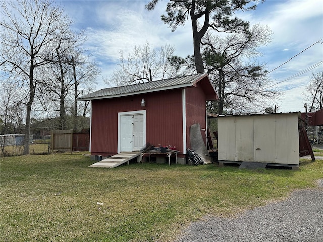 view of shed with fence