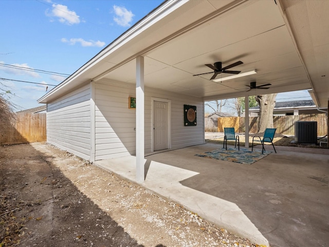 view of patio with central AC unit, a ceiling fan, and fence