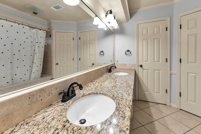 full bathroom featuring crown molding, tile patterned flooring, visible vents, and a sink