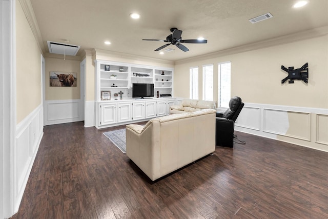 living room featuring attic access, visible vents, dark wood-style floors, ornamental molding, and recessed lighting