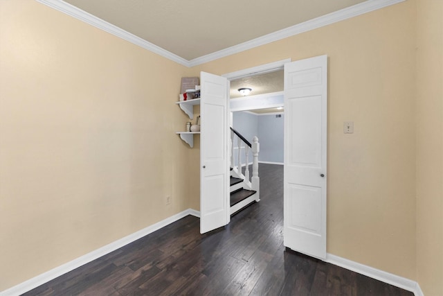 unfurnished bedroom featuring ornamental molding, dark wood-style flooring, and baseboards