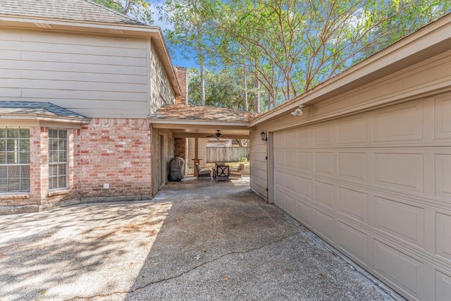 garage featuring concrete driveway