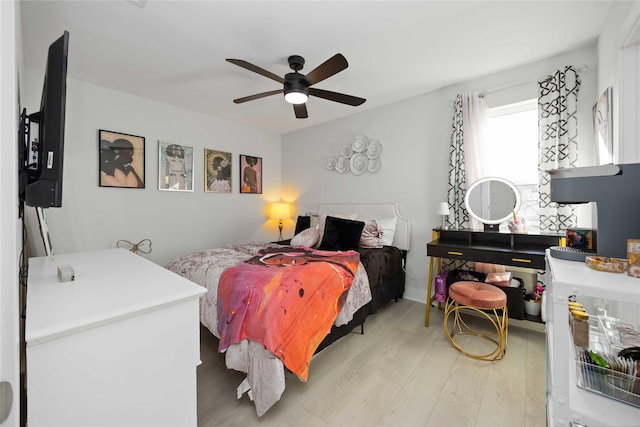 bedroom with light wood finished floors and ceiling fan