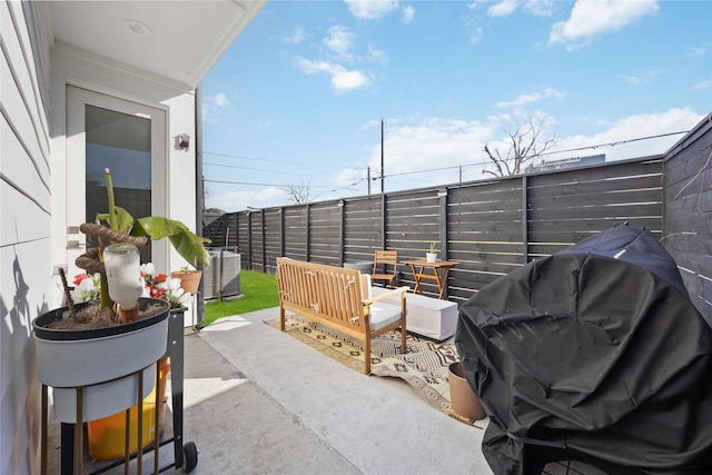 view of patio / terrace with a balcony and grilling area