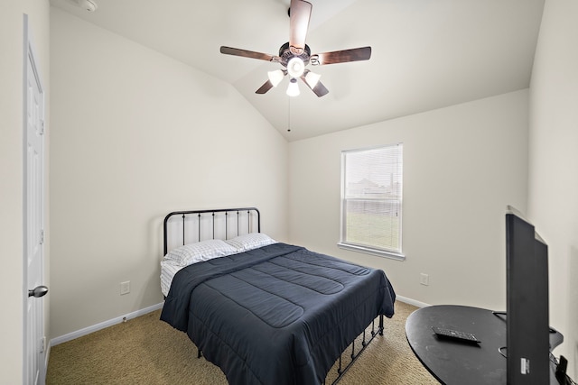 carpeted bedroom featuring vaulted ceiling, ceiling fan, and baseboards