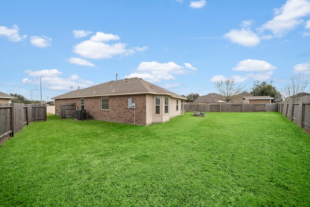 view of yard featuring cooling unit and a fenced backyard