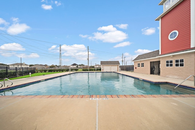 view of pool featuring a patio area, fence, and a fenced in pool